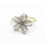 A silver gilt flower ring with diamond accent, O