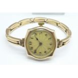 A lady's Art Deco Rolex watch, movement and case stamped Rolex, 9ct gold case and strap, 22.3g gross