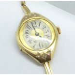 A lady's 14ct gold and diamond Art Deco wristwatch, 19g gross weight, case dented