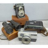 A collection of cameras including Halina, Ricoh and folding, and a pair of field binoculars **PLEASE