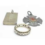 A silver ingot, silver fob and an eternity ring (tests as silver and gold), 47.4g