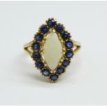 A 9ct gold, opal and sapphire ring, 3.5g, N