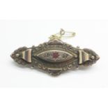 A 9ct gold, ruby and diamond brooch, with steel pin, 4.1g, cased