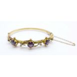 An Edwardian 9ct gold, amethyst and seedpearl bangle, Chester 1907, in original Brittain,