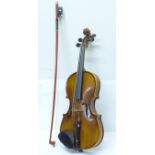 A Golden Strad ¼ size violin and bow, cased, length of back without button 26.25cm