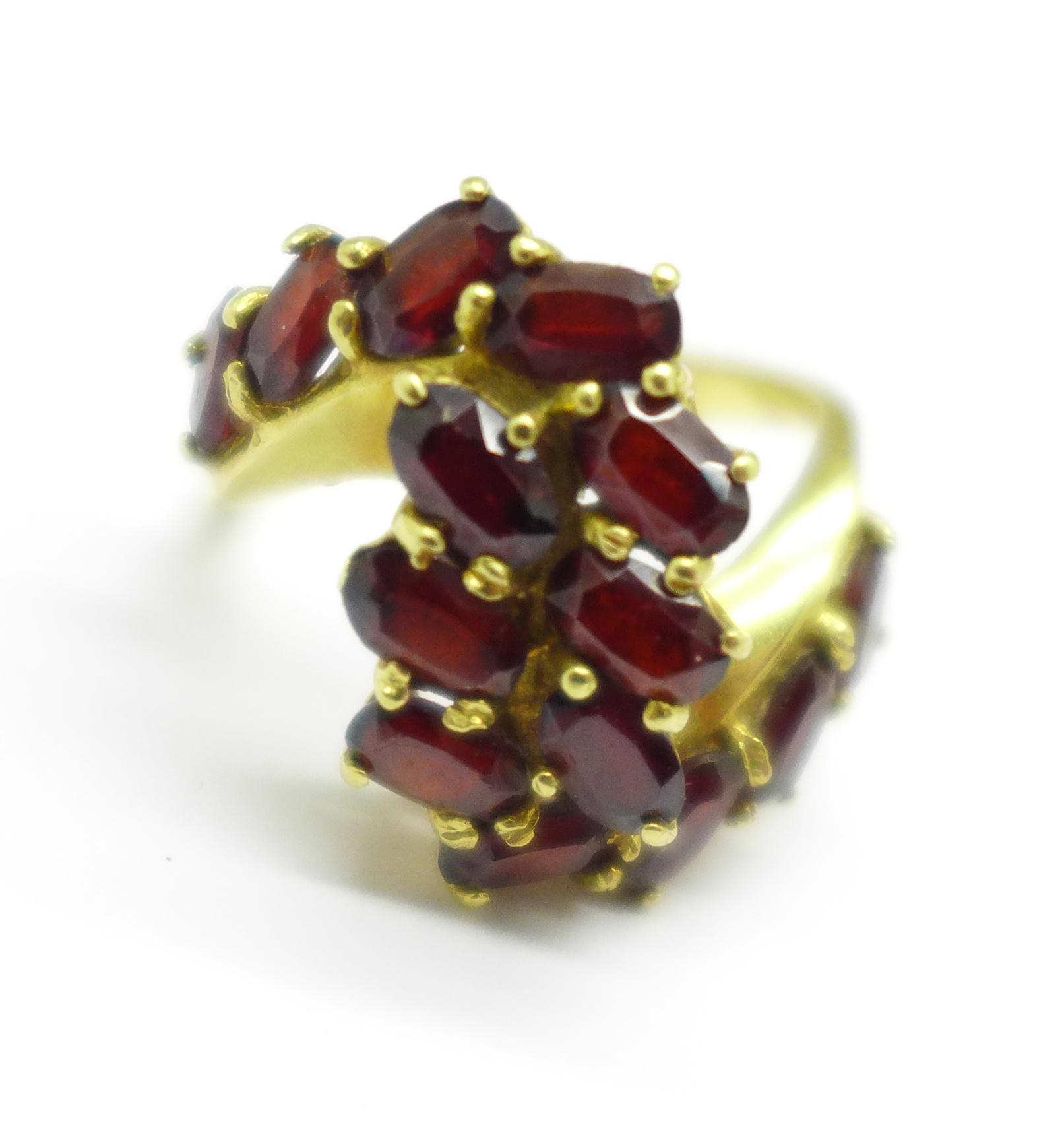 An 18ct gold and garnet cluster ring, 6.2g, L