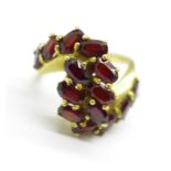 An 18ct gold and garnet cluster ring, 6.2g, L