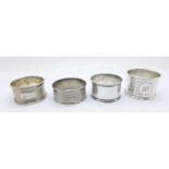 Four silver hallmarked napkin rings, with dates from 1919 to 1955