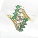 A yellow metal, emerald and diamond ring, marked 585, 3.5g, S