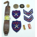 A 1940's wristwatch, shooting badges and other badges