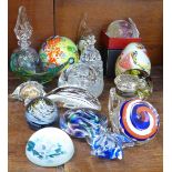 A collection of glass paperweights and a glass inkwell, etc.