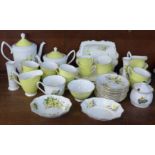 A Royal Albert Primrose coffee set and vases, bowls, etc.