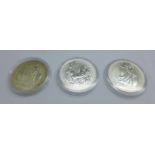 Three Britannia one ounce silver coins, 1998, 1999 and 2000