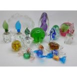 A collection of paperweights, perfume bottles and glass sweets