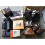 A Canon AE-1 camera with box and other camera equipment, a Printflex Zoom lens, other lenses and two