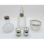 A pair of silver salt and pepper pots and a silver mounted scent bottle, pepper pot and salt pot