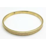 A 9ct gold bangle, 10.8g