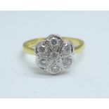 An 18ct gold, flat bed diamond daisy cluster ring, 4.5g, R