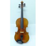 An Andrew Schroetter violin, cased, length of back without button 35.75cm