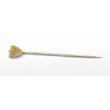 An Edwardian 15ct gold and diamond stick pin, cased, 1.5g