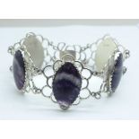 A silver bracelet set with Blue John in large matched marquise cut cabochons measuring 2.5cm x 1.7cm