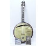 A ukulele banjo, once the property of Eric Delmar, a/f, with photograph of Eric Delmar with