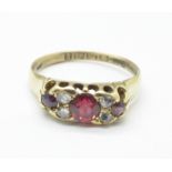 A 18ct gold, garnet and diamond ring, 2.9g, O