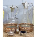 Glassware comprising two claret jugs, a three piece plated cruet set and two copper coasters