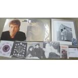 John Lennon 7" singles, LP records, photographs and commemorative stamps commemorating the