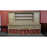 A large George III style pine dresser, 204cma h, 290cms w, 56cms w