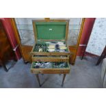 An Edward VII oak canteen of cutlery cabinet on stand, including a quantity of plated flatware