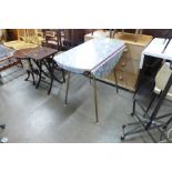 A Formica drop-leaf kitchen table