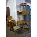 A simulated rosewood drop-leaf kitchen table, two chairs, a teak coffee table, etc.