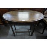 An oak oval occasional table