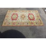 A Turkish cream ground rug