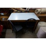 A beech and Formica topped kitchen table and four Ercol painted chairs