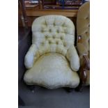 A Victorian mahogany and upholstered armchair