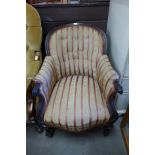 A Victorian mahogany and upholstered armchair