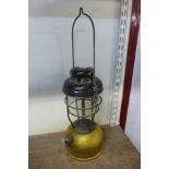 A vintage gold pump Tilley lamp
