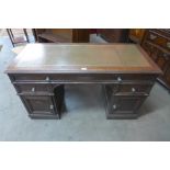 A Victorian oak pedestal desk