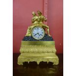 A 19th Century French ormolu and bronze mantel clock, with silk suspension, outside cast wheel and