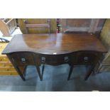 A George III mahogany serpentine sideboard