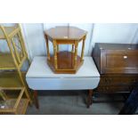 A Formica topped drop-leaf kitchen table and a a teak hexagonal occasional table