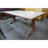 A Gothic Revival hardwood refectory table and six chairs, manner of A.W.N. Pugin, table; 78cms h,