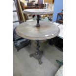 A cast iron two tier pub table