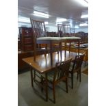 A Vanson teak extending dining table and six chairs