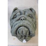 A concrete bust of a bulldog
