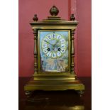 A 19th Century French gilt metal mantel clock, with painted porcelain panels, 35cns h