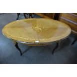 An French style inlaid mahogany oval coffee table