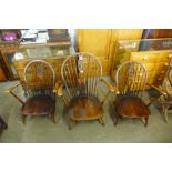 Three Ercol dark low armchairs